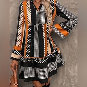 Black striped polka dot print ruffled hem vneck mini dress